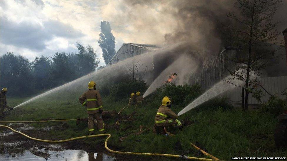 Firefighters tackle wood mill fire