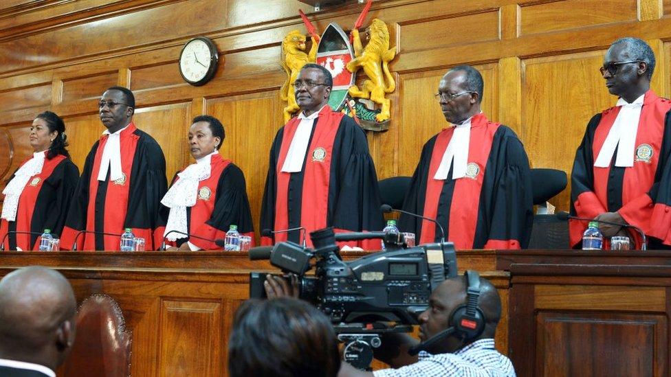 Judges stand to deliver their verdict at the Supreme Court in Nairobi on September 1, 2017, ordering a new presidential election within 60 days after cancelling after cancelling the results of last month's poll.