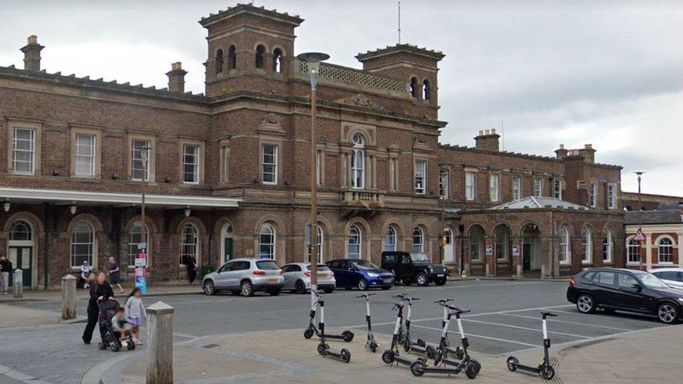 E-scooters outside Chester railway station