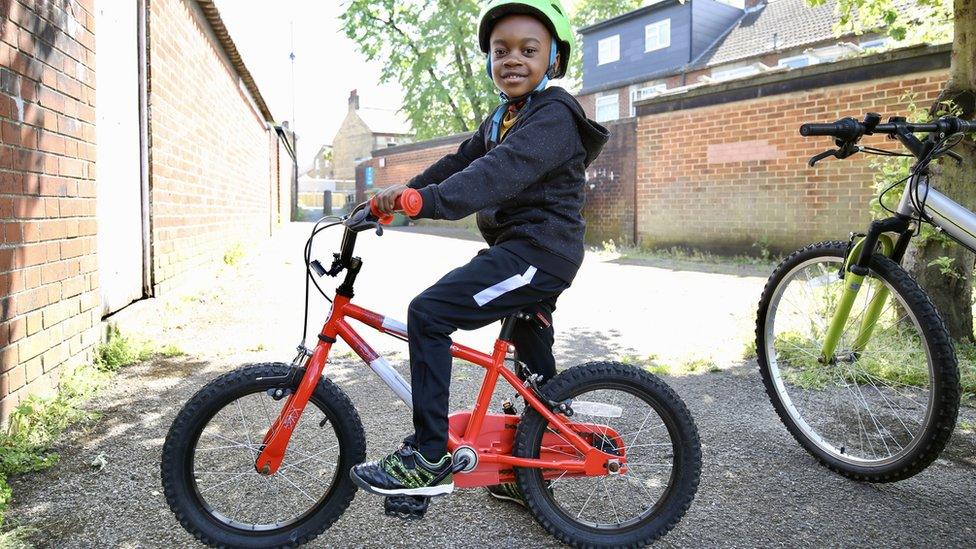 Boy on a bike.