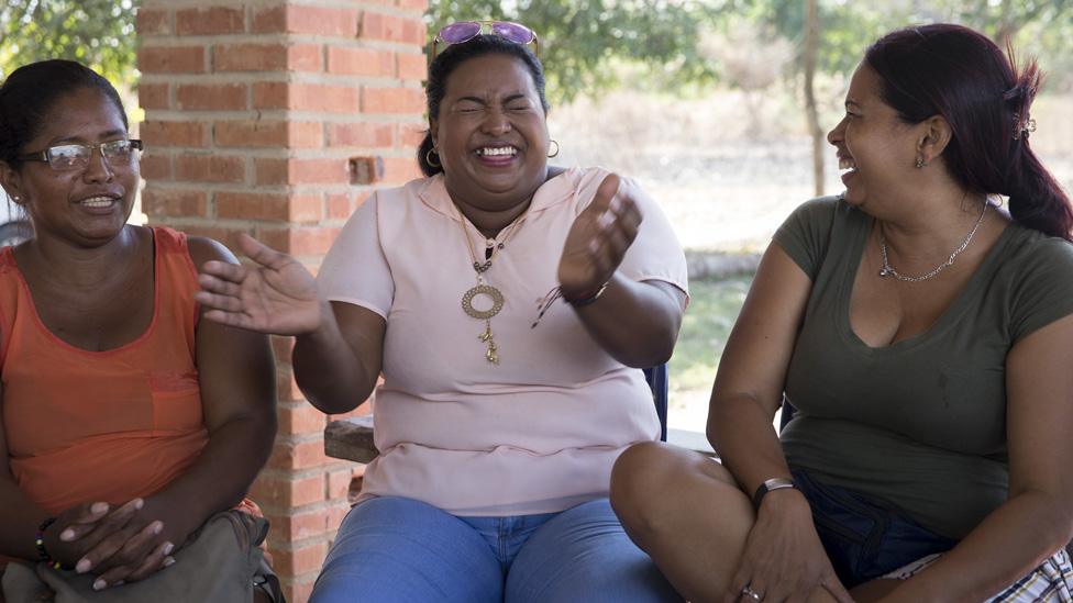 Erika Maria Gamarra Caro, 42, (centre) laughs during a meeting with other members of the League of Displaced Women.