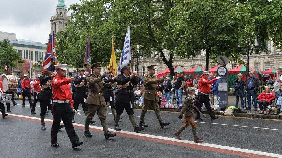 In Belfast, the main parade passes City Hall where it stopped to allow Orangemen to lay a wreath at the Cenotaph before heading on.