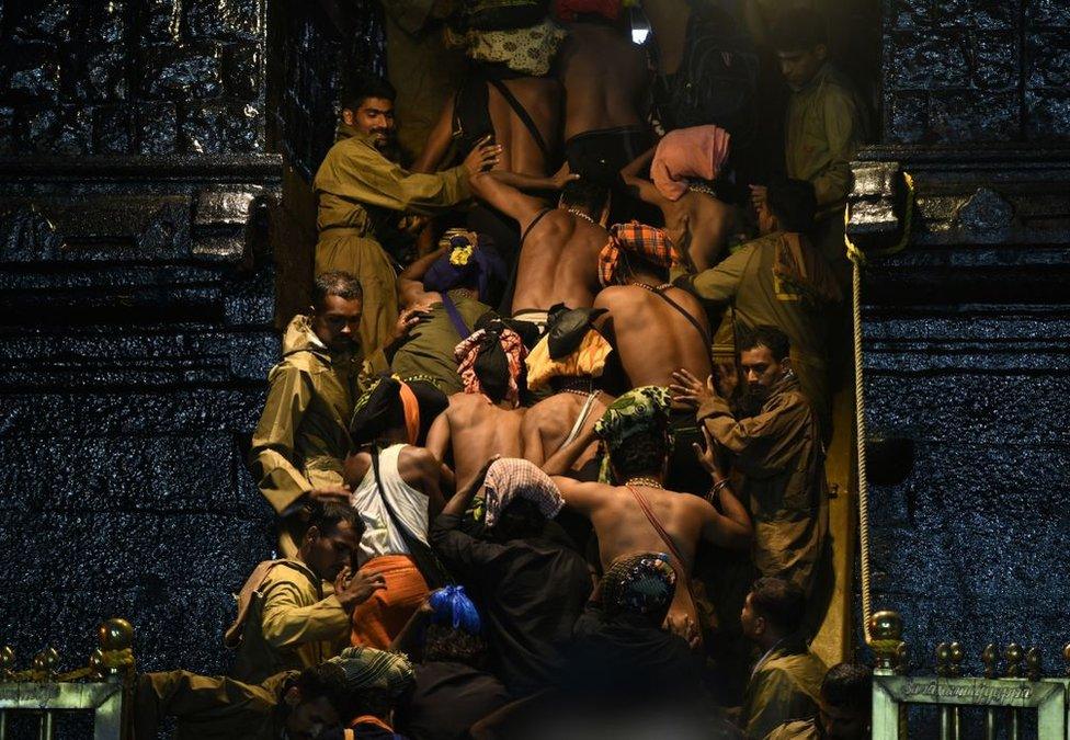 Devotees climbing the steps to the temple.