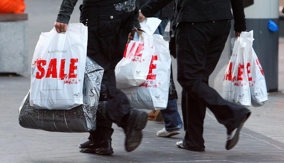 People carrying sale bags