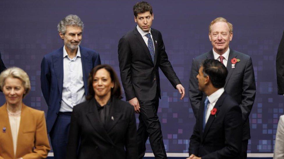 Smal Altman walking behind Ursula von der Leyen, Kamala Harris and Rishi Sunak