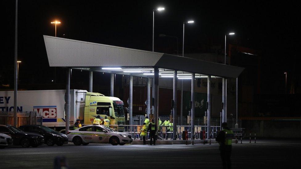 Trucks pass through a customs post at Dublin Port