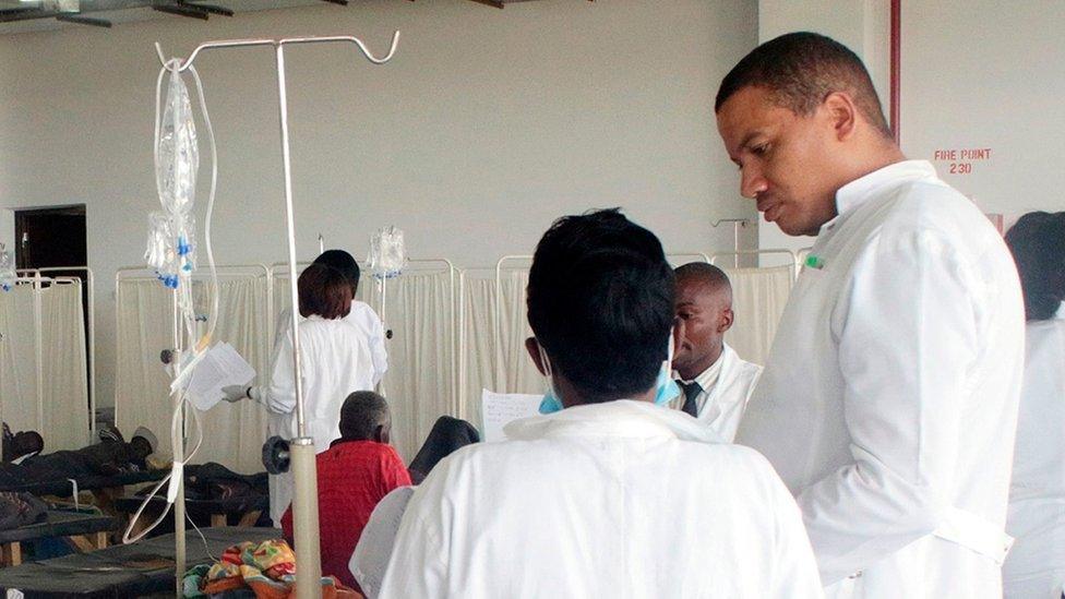 Doctors care for patients affected by Cholera at the Heroes stadium temporary transformed in a hospital on January 15, 2018 in Lusaka, Zambia