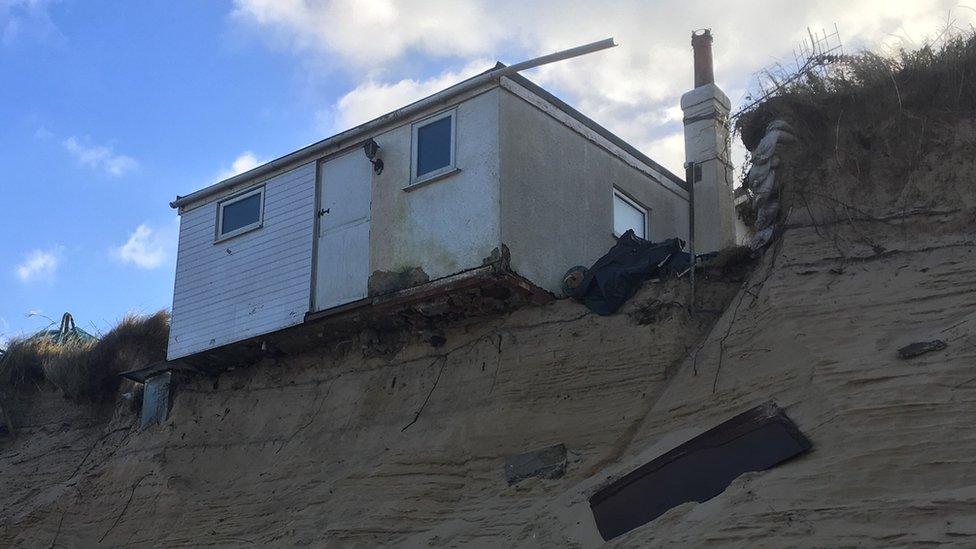 Hemsby house teetering over the sand dune