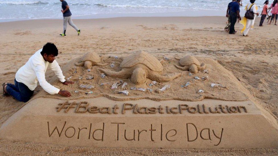 Sand sculpture on beach in India