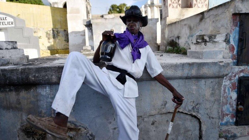 A voodoo devotee in the role of a spirit known as a Gede is seen during ceremonies honouring the Haitian voodoo spirits of Baron Samdi and Gede on the Day of the Dead in Port-au-Prince on 1 November, 2015.