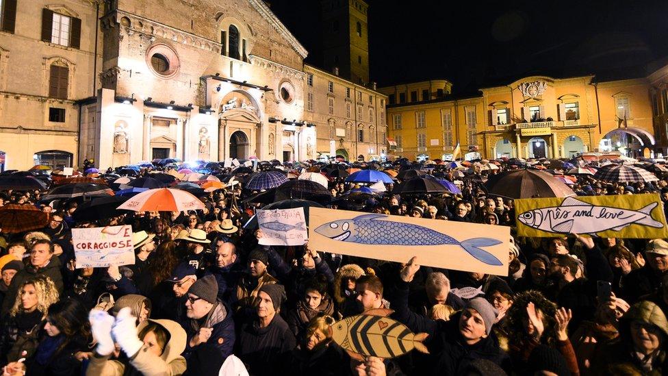 Protesters attend a demonstration held by the "Sardines", a grassroots movement against far-right League leader Matteo Salvini, in Reggio Emilia, Italy, 23 November 2019