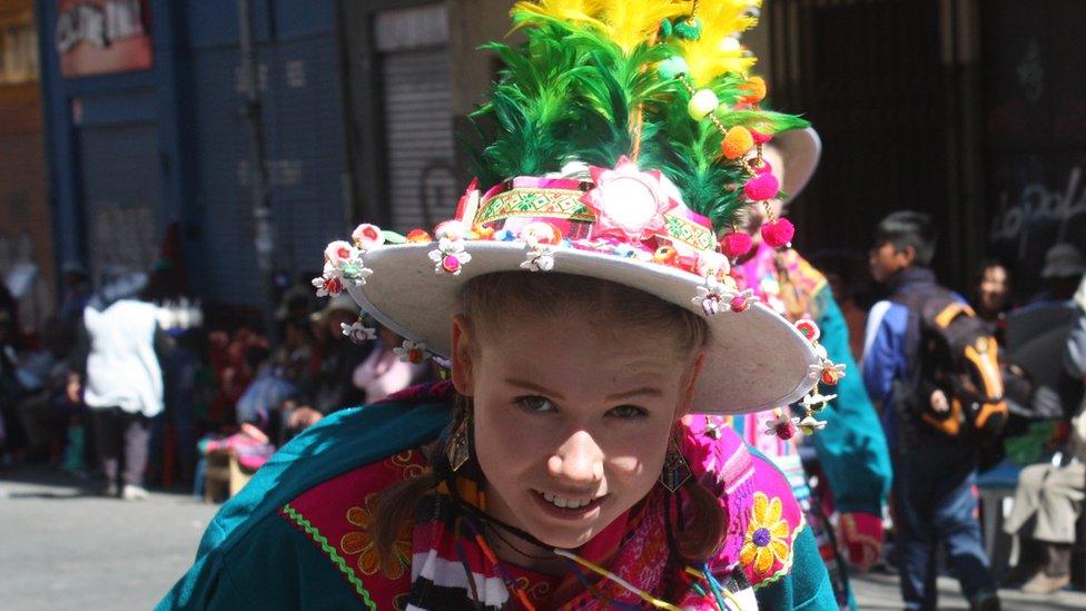 A girl looks into the camera