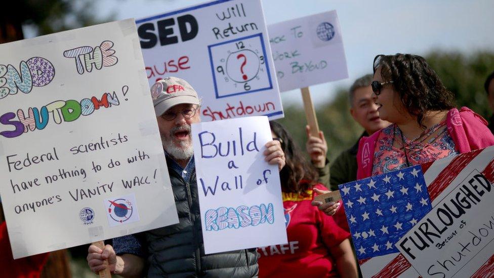 Protesters rally outside the NASA Ames Research Center calling for an end to the government shutdown in Mountain View, Calif., on Friday, Jan. 18,