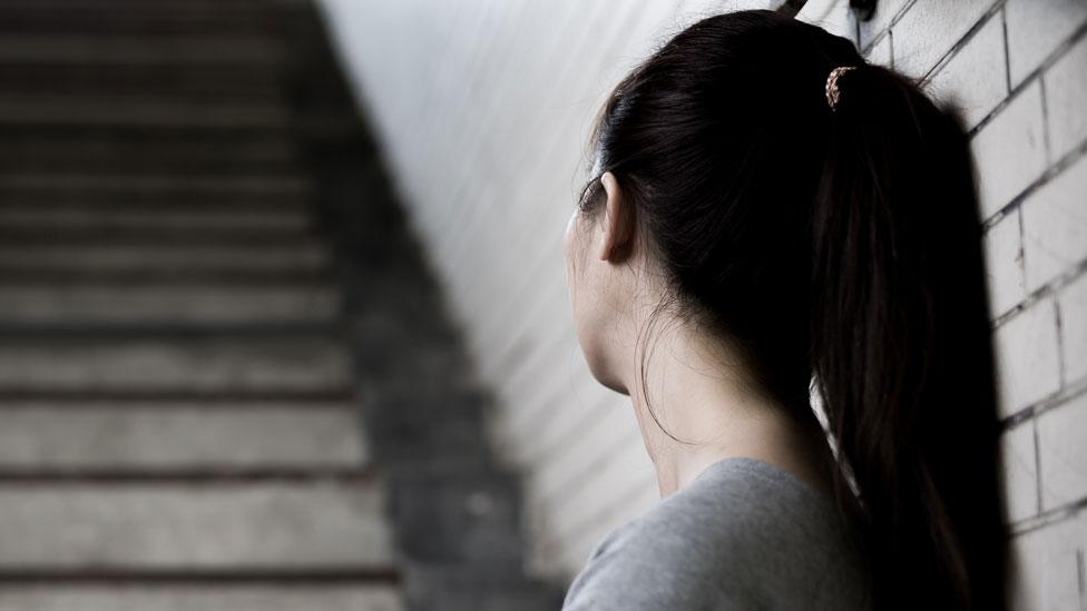 Woman with her head turned from camera.