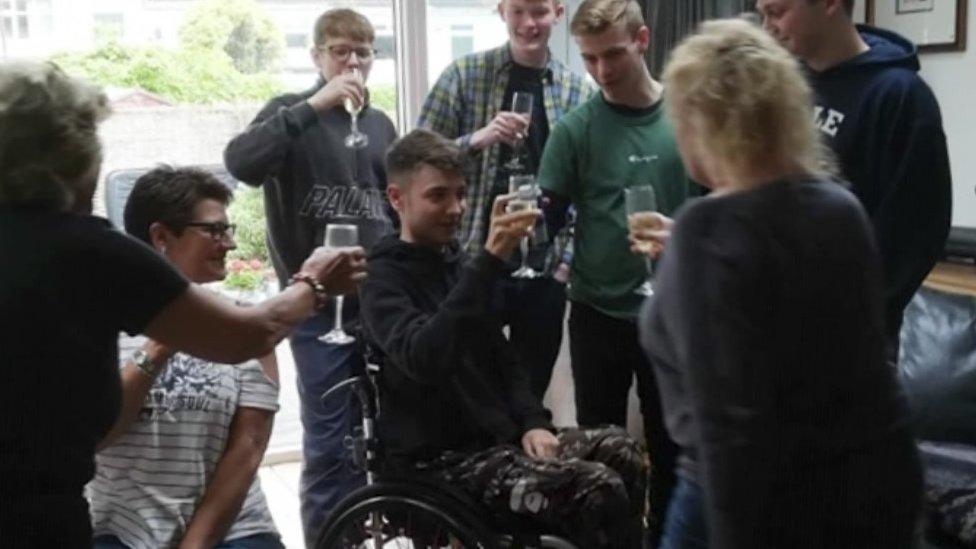 Family holding champagne glasses