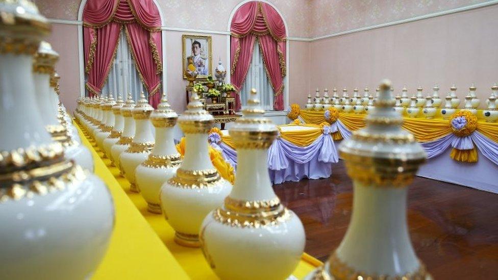 A picture of Thailand's King Maha Vajiralongkorn is seen among ewers containing sacred water for his upcoming coronation ceremony at the Interior Ministry in Bangkok, Thailand, April 10, 2019.