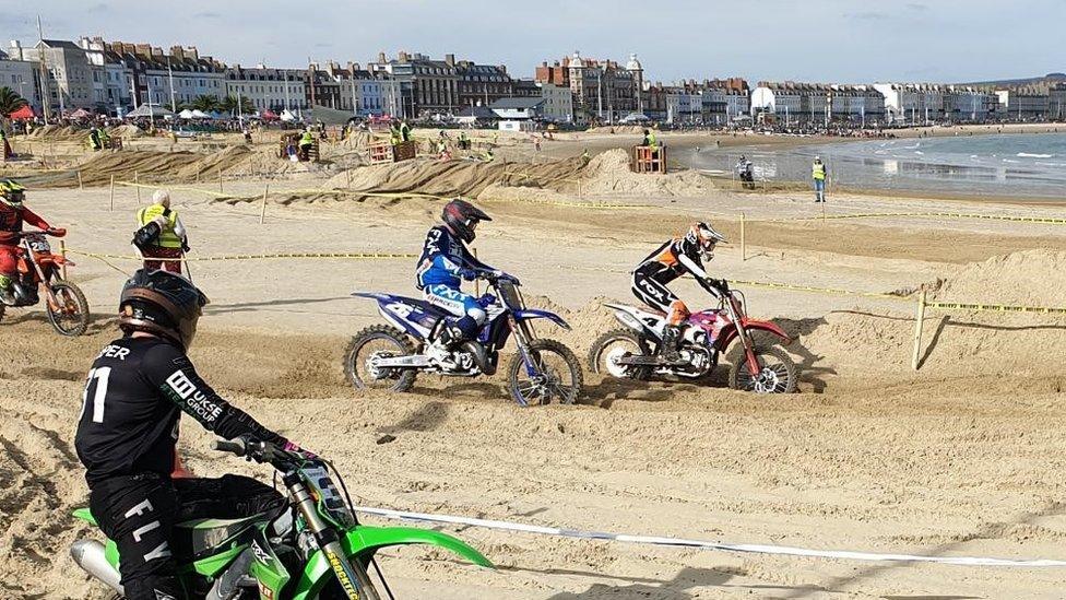 Motocross riders on Weymouth beach