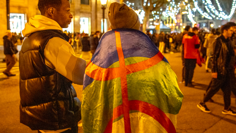 A Moroccan football fan draped in a Amazigh flag in Spain - 6 December 2022