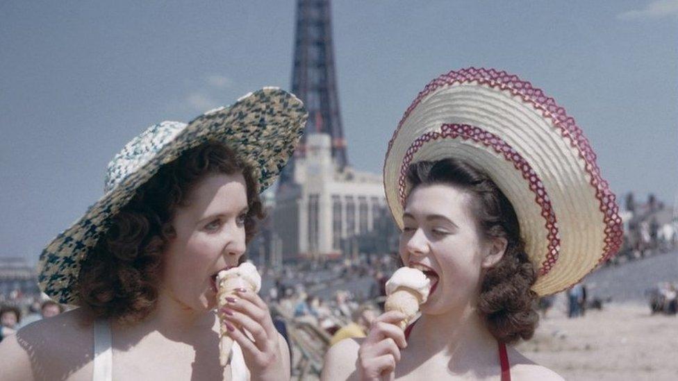 Girls eat ice cream in front of Blackpool Tower circa 1958