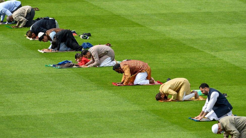 Muslim men perform Eid al-Adha prayers on Dublin's Croke Park pitch