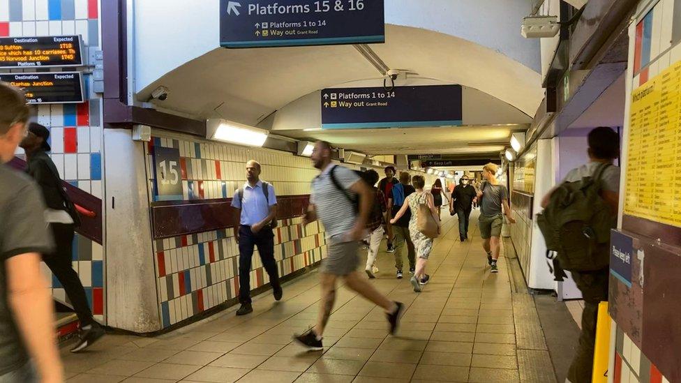 People running through Clapham Junction station