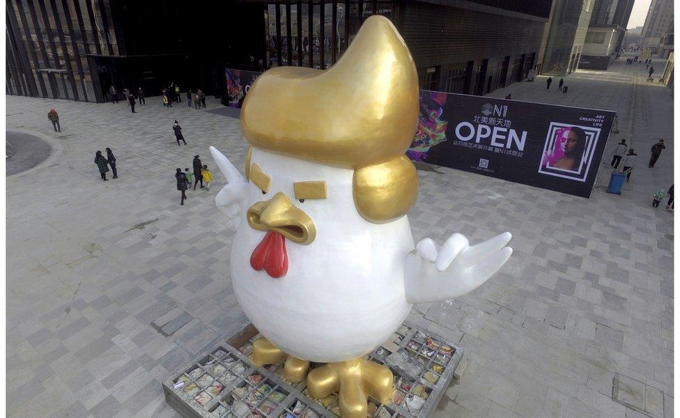 A giant rooster sculpture resembling Donald Trump outside a shopping mall in Taiyuan, Shanxi province. 24 December 2016.