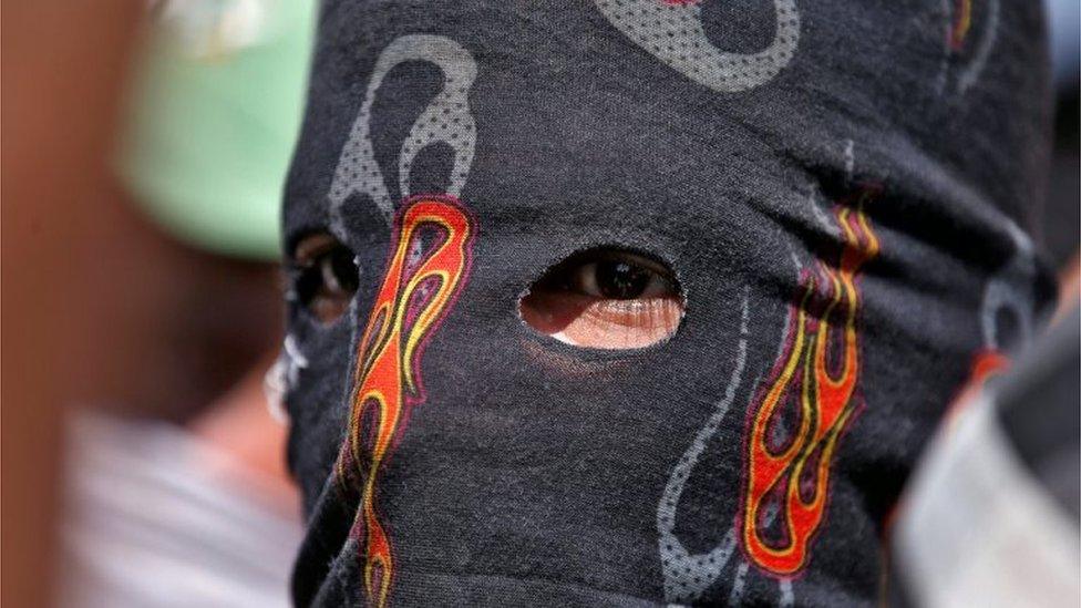 A masked protester attends a protest in Srinagar, against the recent killings in Kashmir September 18, 2016