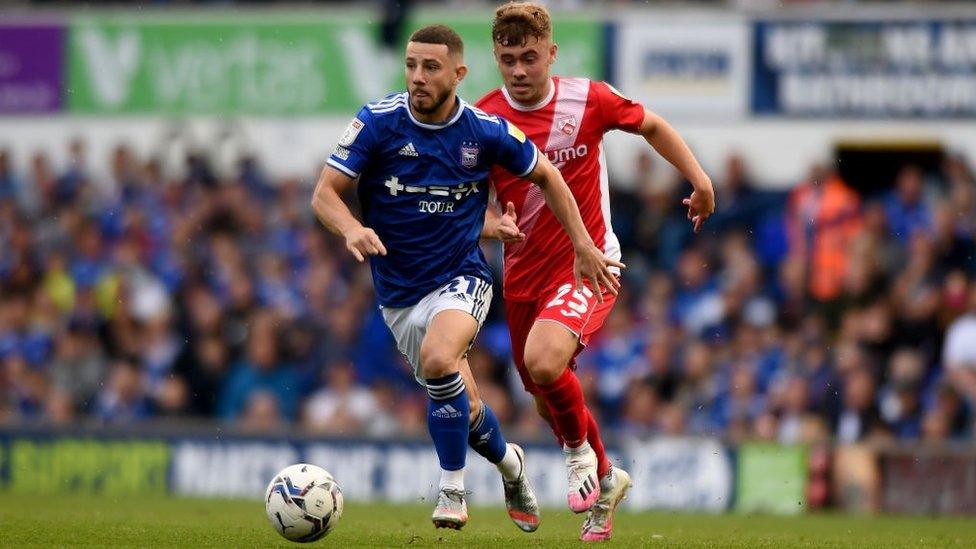 Ipswich Town's Conor Chaplin battles with Morecambe's Alfie McCalmont during the Sky Bet League One match between Ipswich Town and Morecambe at Portman Road on August 7, 2021