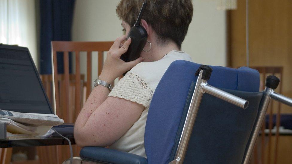 Stock image of the disabled woman working from home