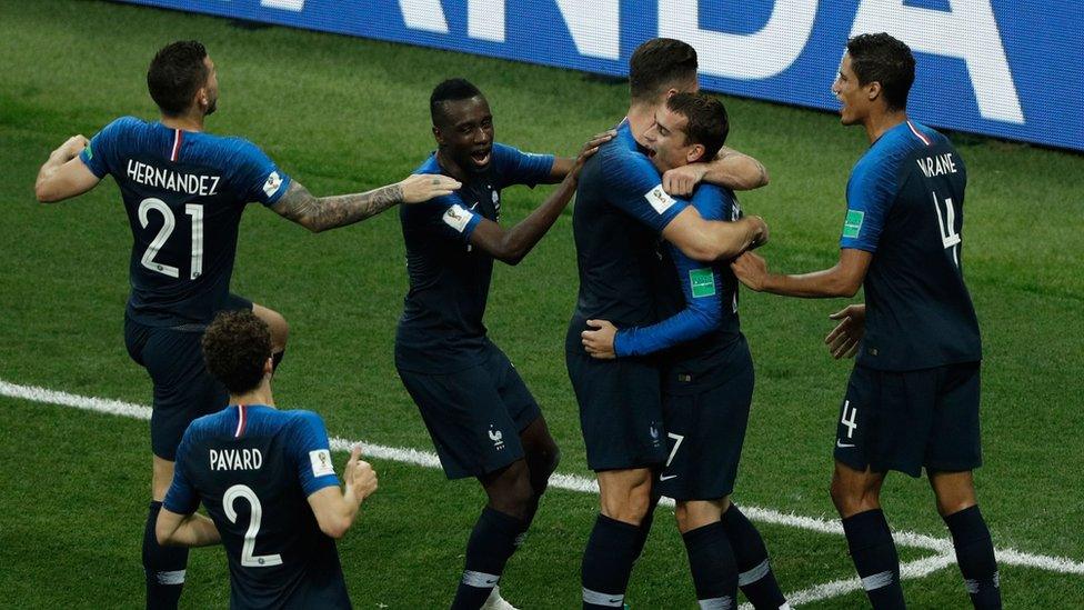 France's Antoine Griezmann (C) celebrates with teammates after scoring a goal during the Russia 2018 World Cup final football match, 15 July 2018