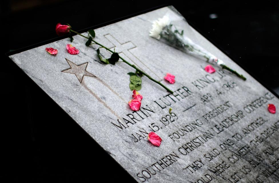 A commemorative plaque honoring Martin Luther King Jr. is covered with flowers outside the Lorraine Hotel, the site where Martin Luther King Jr was assassinated, April 4, 2008 in Memphis, Tennessee