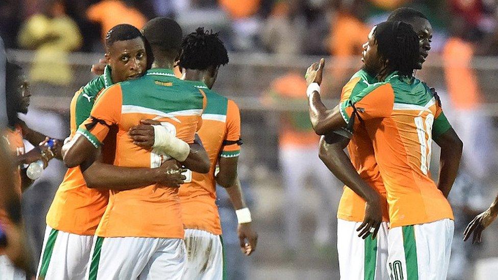 Ivory Coast players celebrate after qualifying for January's Nations Cup.