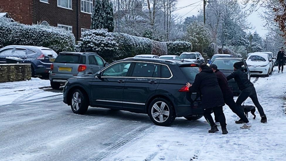 Car being pushed on Whirley Road in Macclesfield