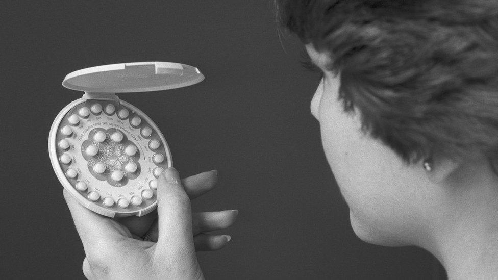 A photo from 1976 shows a woman holding a pack of contraceptive pills