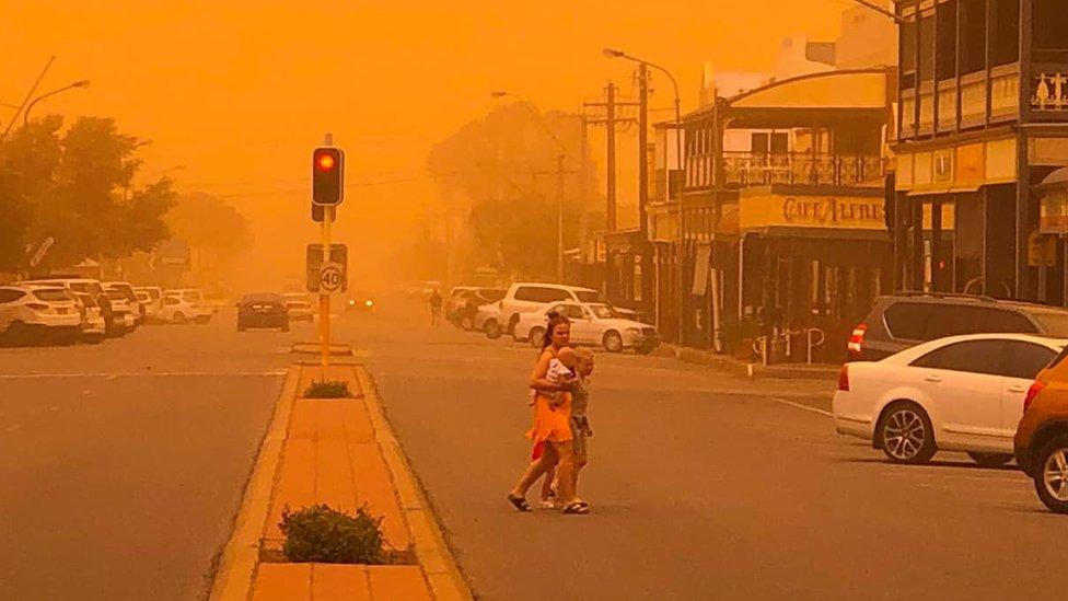 A main street in Broken Hill turned orange by a dust storm