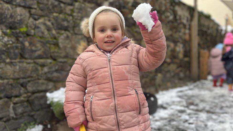 Child playing with the snow in Jersey