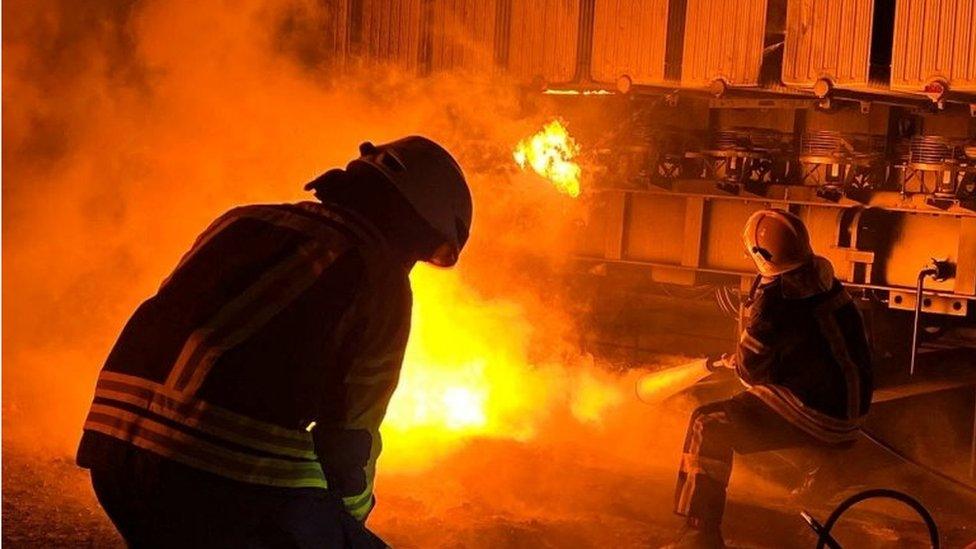 Firefighters work to put out a fire at energy infrastructure facilities, damaged by Russian missile strike, as Russia"s attack on Ukraine continues, in Kyiv region, Ukraine November 15, 2022