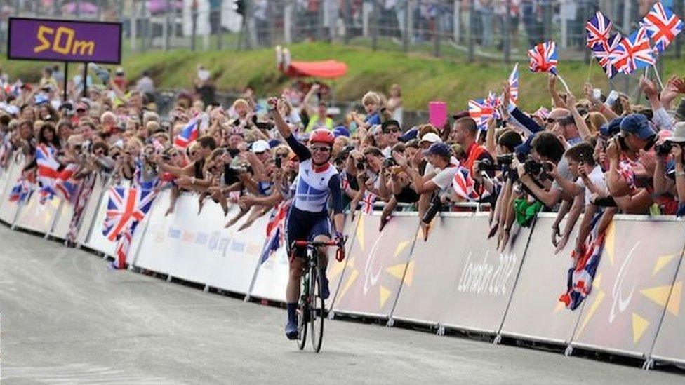 Sarah Storey celebrates winning the road race at London 2012