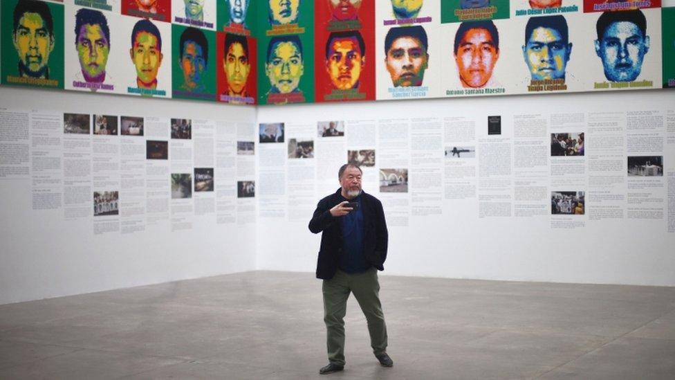 Ai Weiwei poses for photos