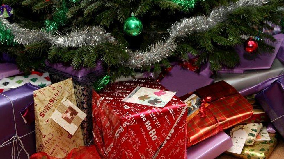 Wrapped presents under a Christmas tree