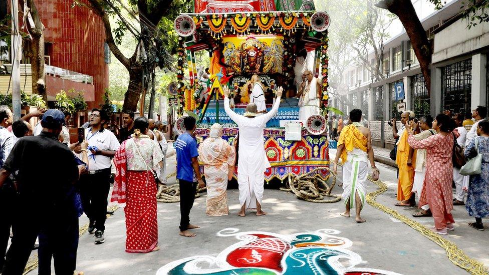 Indian devotees pull the rope of a holy chariot bearing Lord Jagannatha during Rath Yatra, or the Chariot Journey Festival, in Kolkata, Eastern India, 20 June 2023.