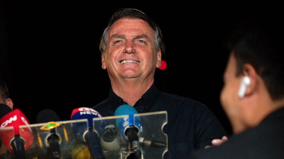 Incumbent and candidate Jair Bolsonaro of Liberal Party (PL) talks during a press conference at the end of the general elections day at the main entrance of Alvorada Palace on October 02, 2022