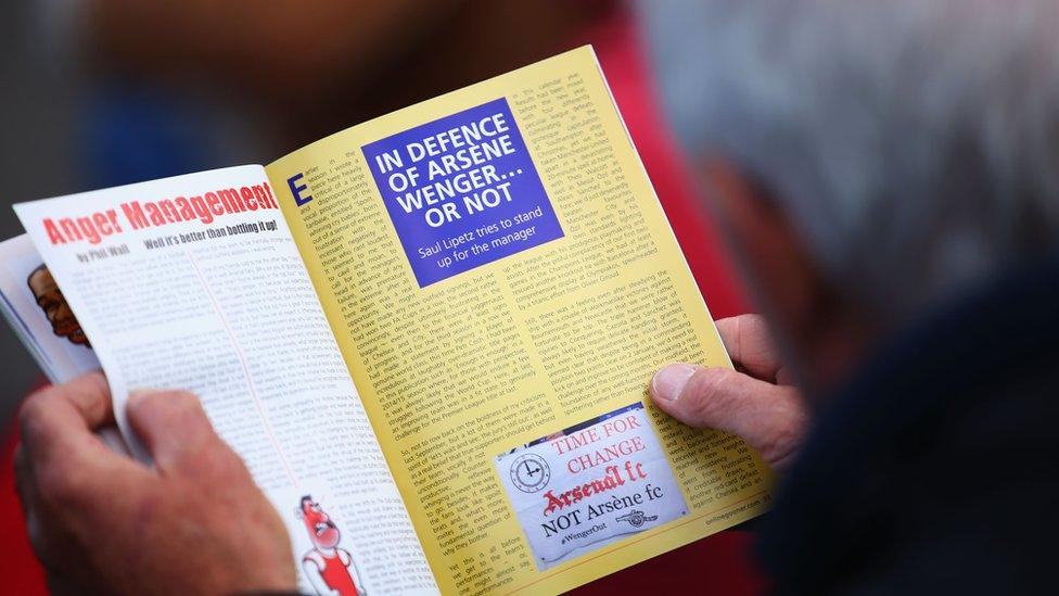 Fan reads a copy of The Gooner