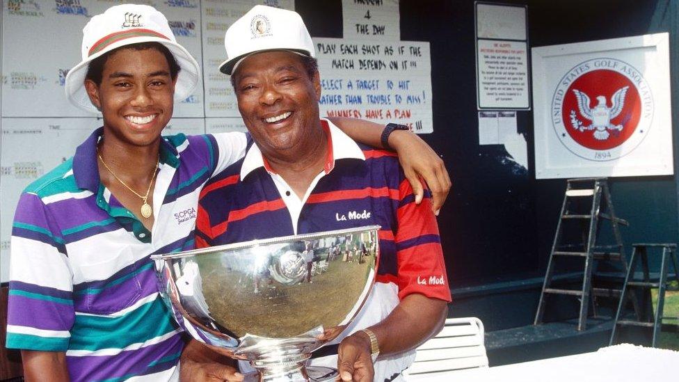 Tiger Woods with his father after he won the USGA Junior Amateur Championships in Orlando in July 1991