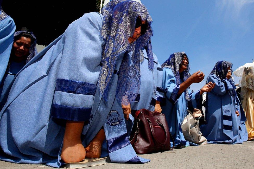 Followers of Mexico-based Pentecostal church La Luz del Mundo (Light of the World), pray during its annual gathering in Guadalajara