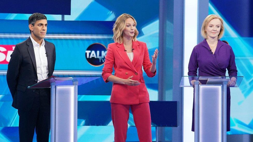 Rishi Sunak and Liz Truss seen on stage with moderator Kate McCann ahead of Tuesday's debate hosted by TalkTV