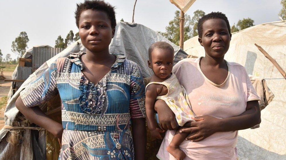 Two women with children in camp in Burundi