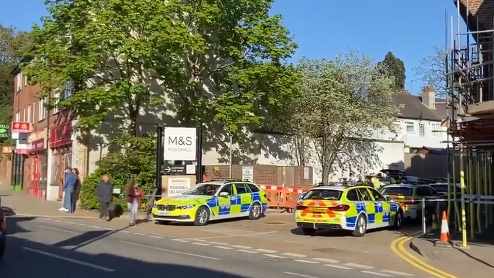 A cordon is in place behind Marks and Spencer and the car park is closed