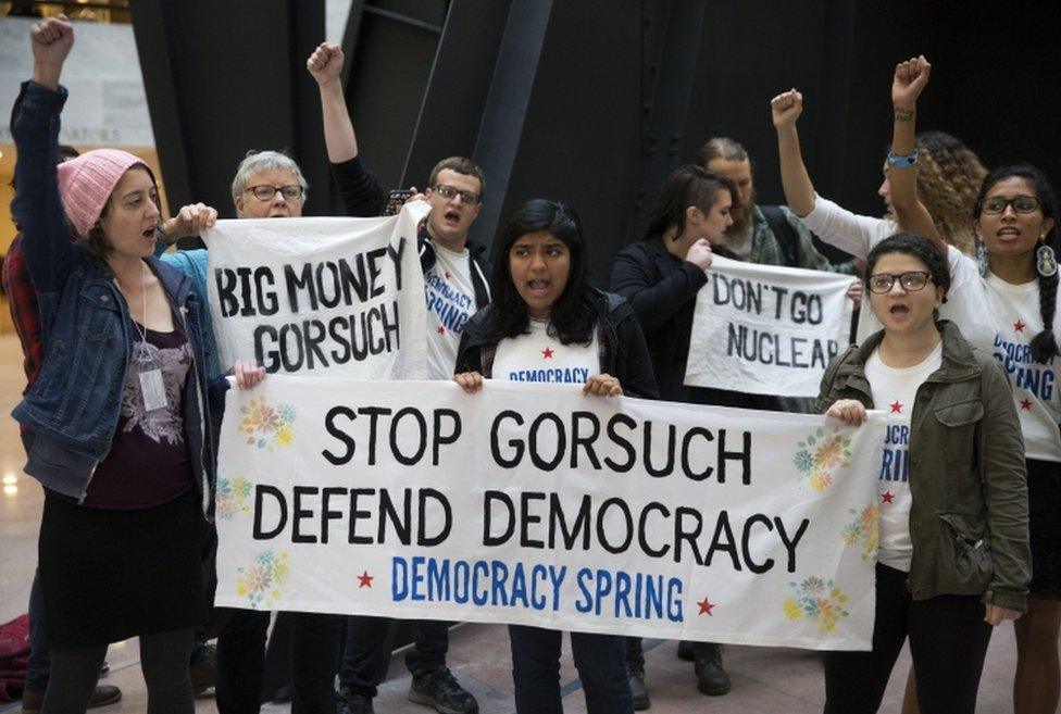 Protesters rally in a Senate office building on Thursday