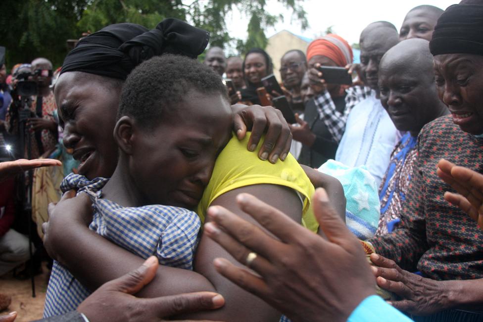 A mother hugs her daughter on July 25, 2021 after she was released together with other 27 students of the Bethel Baptist High School.